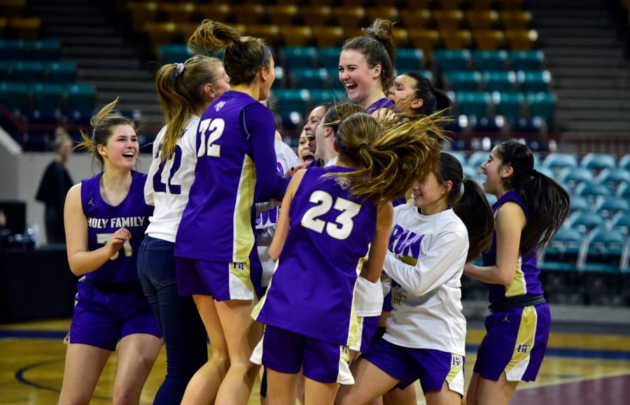 DENVER, CO - The Holy Family High School girls celebrate victory over Green Mountain during a CHSAA State Semifinal game on Thursday at the Denver Coliseum. (Photo by Jeremy Papasso/Staff Photographer)