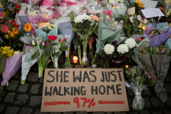 A sign is seen as people gather at a memorial site in Clapham Common Bandstand, following the kidnap and murder of Sarah Everard, in London, Britain March 13, 2021. REUTERS/Hannah McKay     TPX IMAGES OF THE DAY