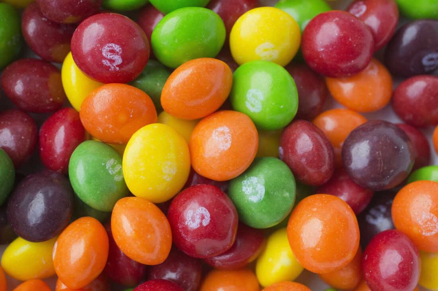 FILE- This June 1, 2016, file photo shows Skittles in New York. Skittles has temporarily ditched its rainbow theme in favor of an all-white look in the United Kingdom and Germany in order to celebrate LGBT pride. (AP Photo/Mark Lennihan, File)